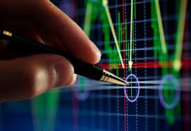 Hand analyzing financial chart with pen. Hand analyzing financial chart with pen.