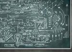 Complex diagrams and formulas on chalkboard.
