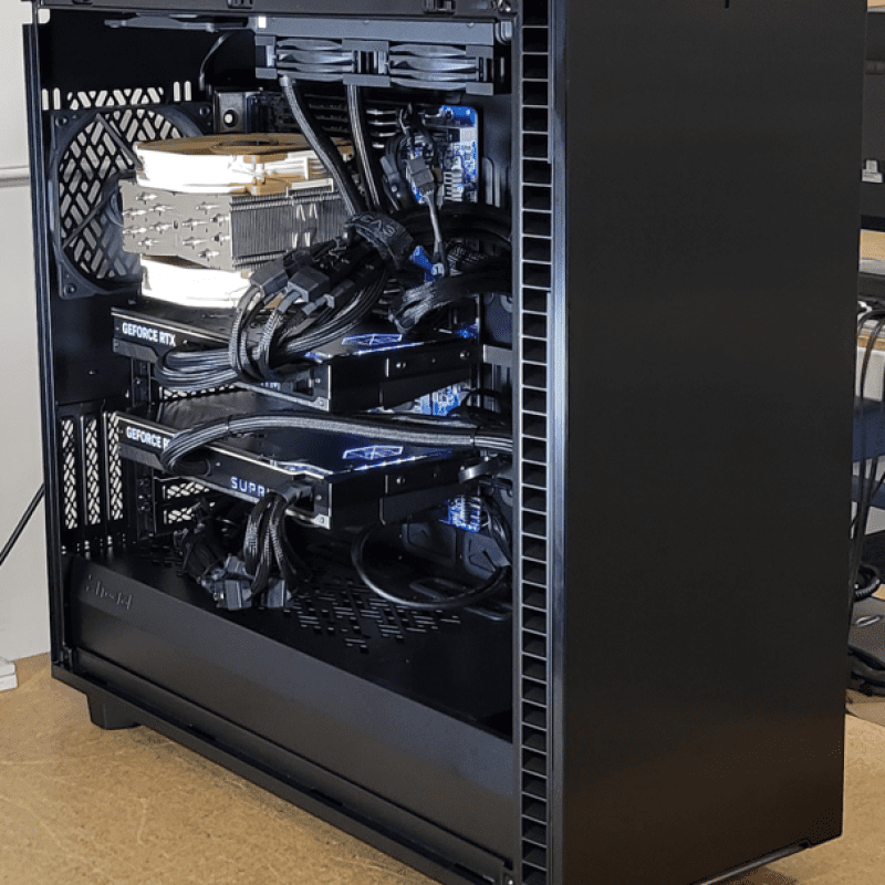 Open computer case with multiple graphics cards.