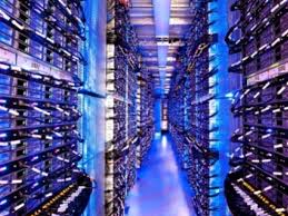 Blue-lit server room with multiple racks. Blue-lit server room with multiple racks.