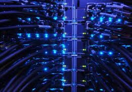 Blue-lit server cables in a data center.