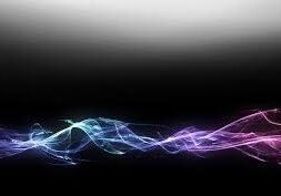 Colorful light waves on dark gradient background.