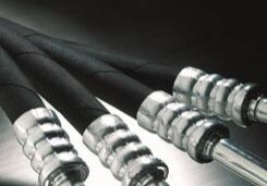Black hydraulic hoses with metal fittings.