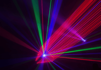 Colorful laser beams in dark room.