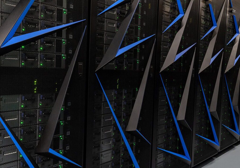 Close-up of server racks with blue cable management in a data center.
