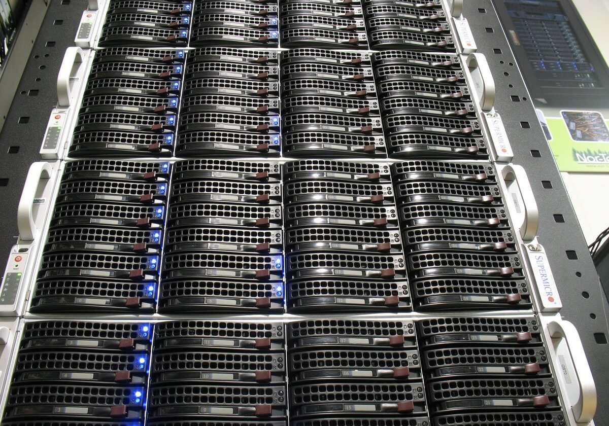 Rack-mounted servers with glowing indicator lights.